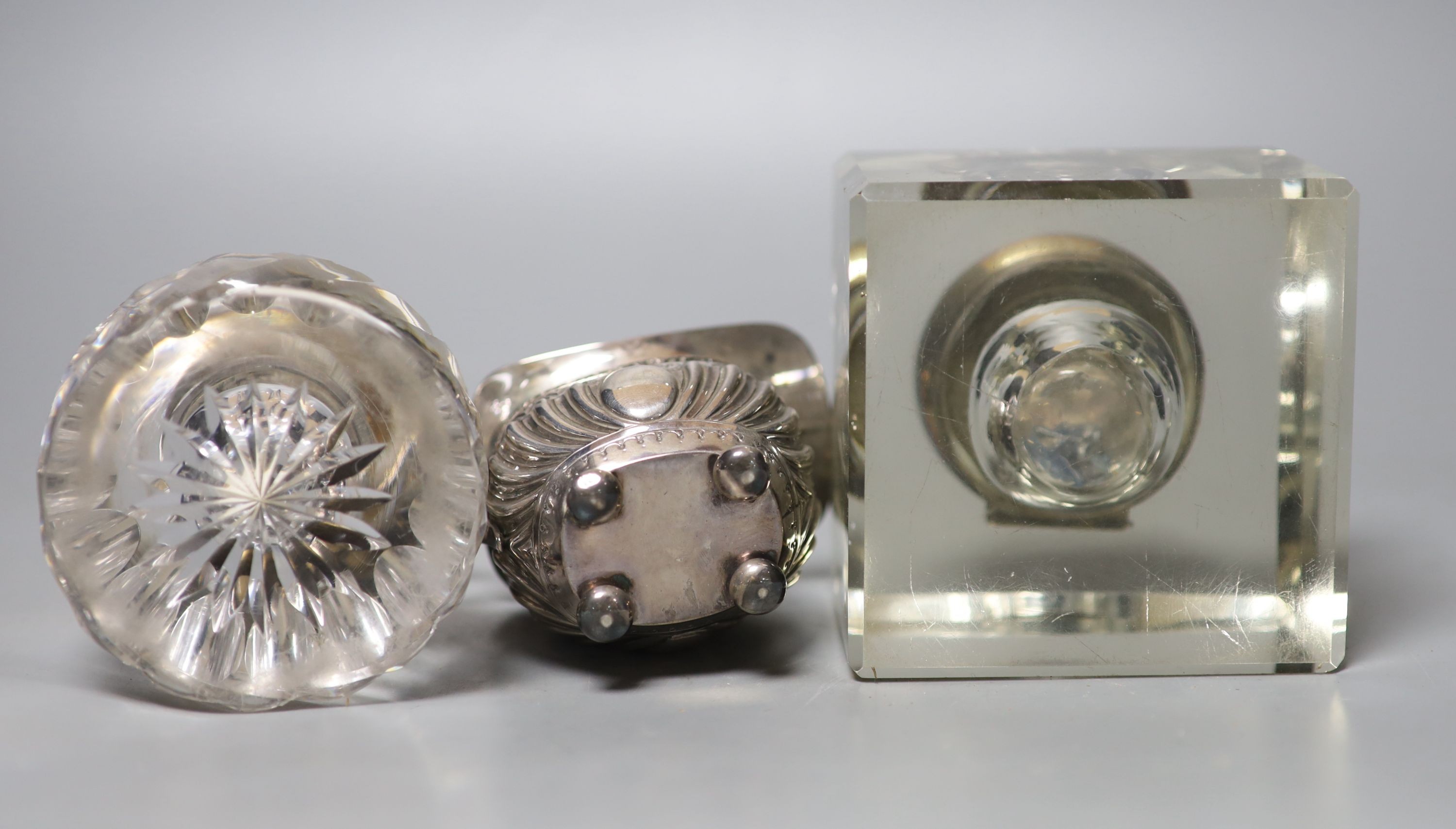 A late Victorian silver cream jug and two silver mounted glass inkwells.